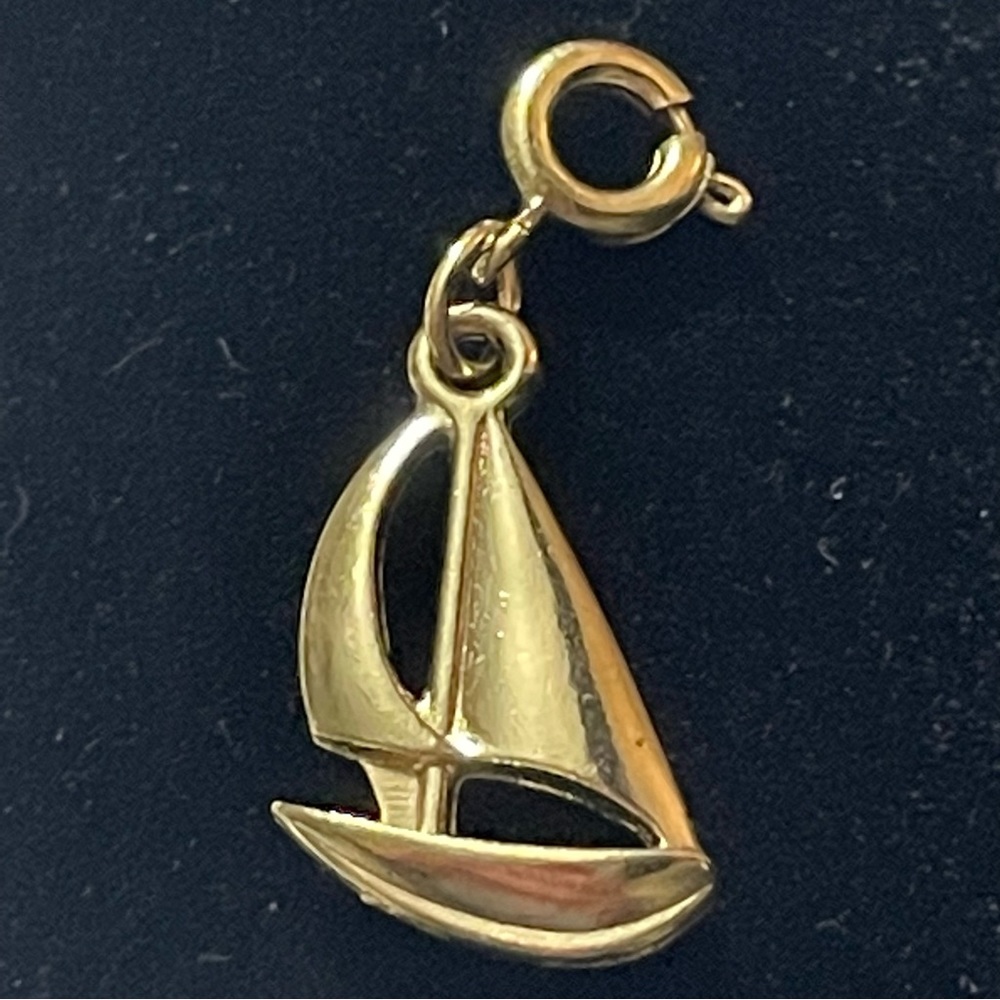 Vintage Diamonds International gold toned sailboat charm.